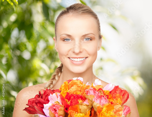 Photo: lovely woman with red flowers lovely woman with red flowers