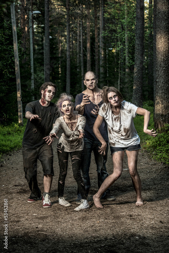 Photo: scary bloody zombies waiting for a prey scary bloody zombies waiting for a prey