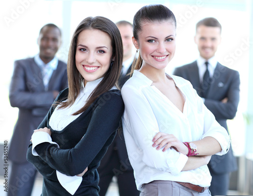 Photo: Two business women team at office building Two business women team at office building