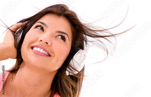 Photo: Happy woman with headphones - isolated over a white background Happy woman with headphones - isolated over a white background