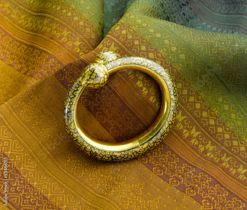 Photo: Beautiful golden bracelet design in ancient Thai style Beautiful golden bracelet design in ancient Thai style
