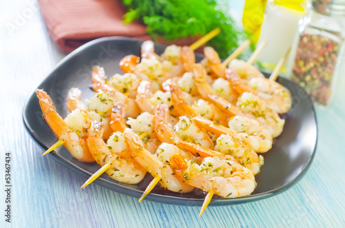 Photo: boiled shrimps are beaded on sticks boiled shrimps are beaded on sticks
