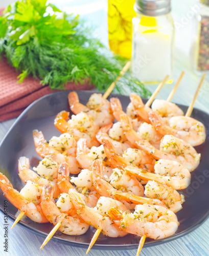 Photo: boiled shrimps are beaded on sticks boiled shrimps are beaded on sticks