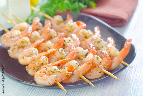 Photo: boiled shrimps are beaded on sticks boiled shrimps are beaded on sticks