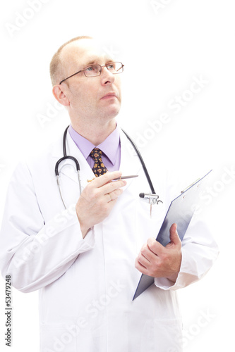 Photo: Male medical physician comparing some information Male medical physician comparing some information