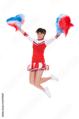Photo: Cheerleader Jumping With Pom-pom Cheerleader Jumping With Pom-pom