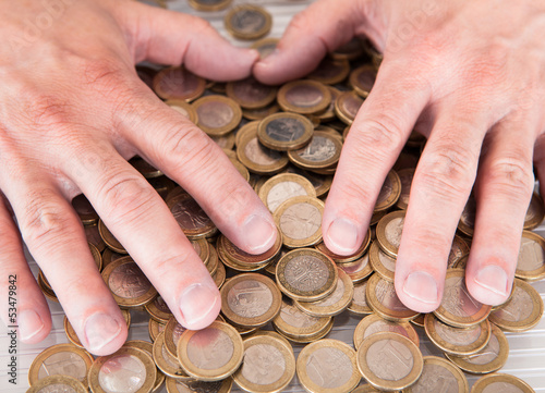 Photo: Male Hand On Coins Male Hand On Coins