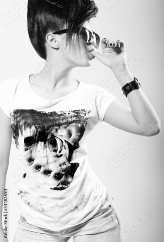 Photo: Coquette. Eccentric Trendy Woman in Dark Sunglasses Coquette. Eccentric Trendy Woman in Dark Sunglasses