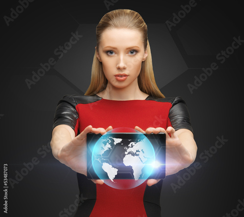 Photo: woman holding tablet pc with sign of globe woman holding tablet pc with sign of globe