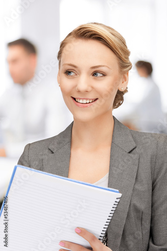 Photo: happy woman with big notepad happy woman with big notepad