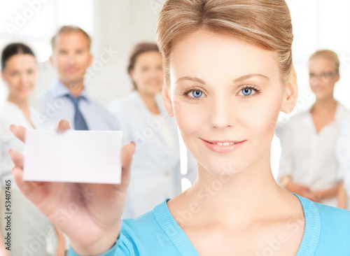 Photo: woman with blank business or name card woman with blank business or name card