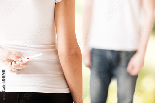 Photo: woman hiding pregnancy test woman hiding pregnancy test