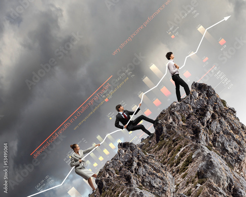 Photo: Businesspeople pulling graph Businesspeople pulling graph