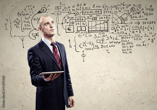 Photo: Businessman with ipad in hands Businessman with ipad in hands