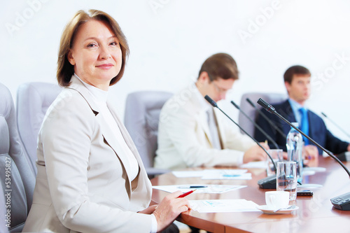 Photo: Three businesspeople at meeting Three businesspeople at meeting