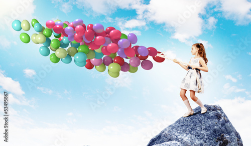 Photo: Little girl with balloons Little girl with balloons