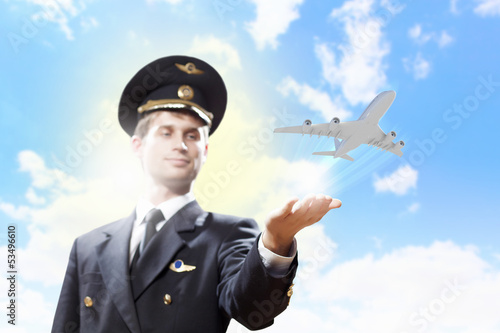 Photo: Image of pilot with plane in hand Image of pilot with plane in hand