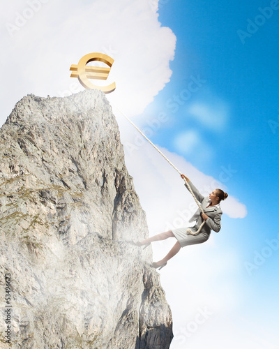 Photo: businesswoman climbing mountain businesswoman climbing mountain