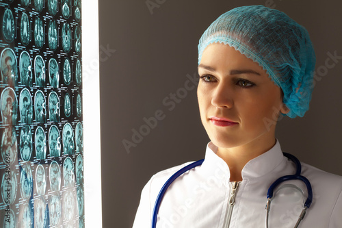 Photo: Woman doctor examining x-ray Woman doctor examining x-ray