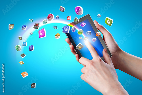 Photo: Close-up of hands holding tablet pc Close-up of hands holding tablet pc