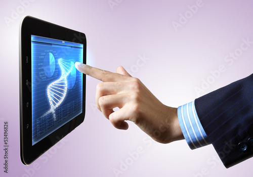 Photo: Dna strand On The Tablet Screen Dna strand On The Tablet Screen
