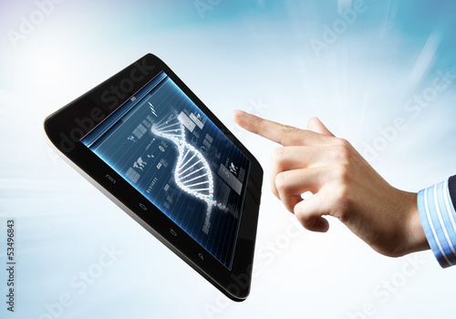 Photo: Dna strand On The Tablet Screen Dna strand On The Tablet Screen
