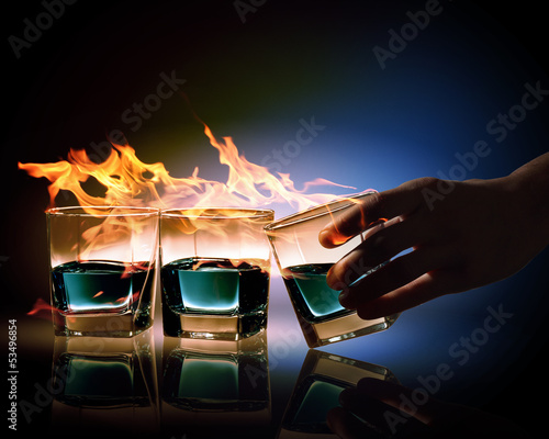 Photo: Three glasses of burning emerald absinthe Three glasses of burning emerald absinthe