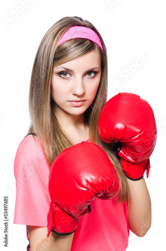 Photo: Young lady with boxing gloves on white Young lady with boxing gloves on white