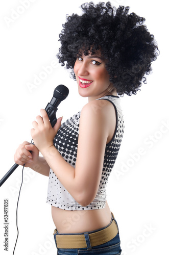 Photo: Pop star with mic on white Pop star with mic on white