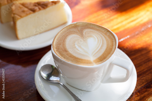 Photo: Cup of latte coffee with cake Cup of latte coffee with cake