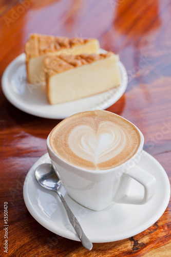 Photo: Cup of latte coffee with cake Cup of latte coffee with cake