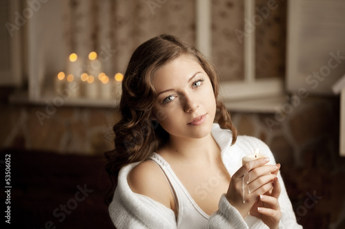 Photo: Beautiful woman with a candle Beautiful woman with a candle