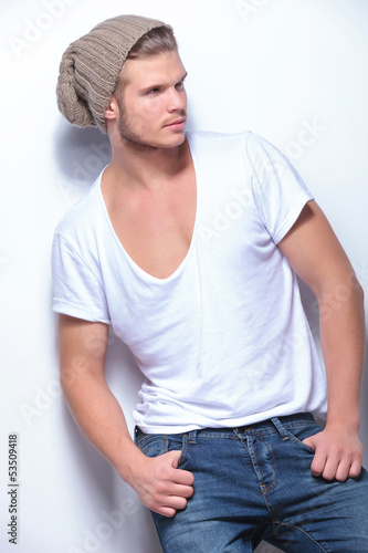 Photo: fashion man holds thumbs in pockets fashion man holds thumbs in pockets