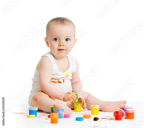 Photo: dirty baby drawing with a finger's paints dirty baby drawing with a finger's paints