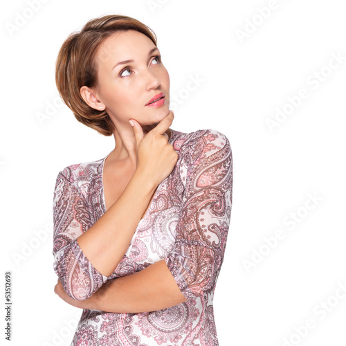 Photo: Portrait of the pretty thinking woman on white Portrait of the pretty thinking woman on white