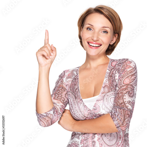 Photo: happy woman pointing up with her finger happy woman pointing up with her finger