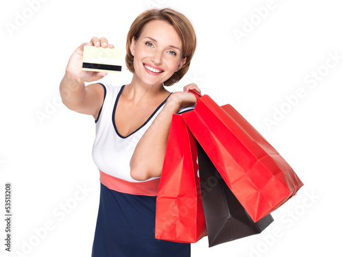 Photo: Woman with shopping bags and credit card Woman with shopping bags and credit card