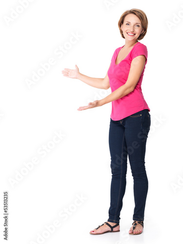 Photo: Full portrait of adult happy woman with presentation gesture Full portrait of adult happy woman with presentation gesture