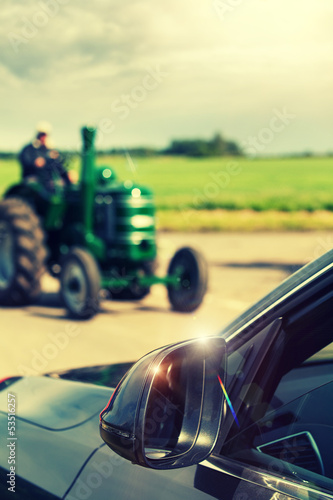 Photo: tractor passing car tractor passing car