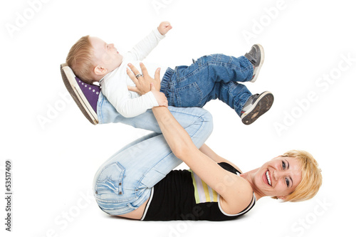 Photo: Beautiful happy mather with attractive baby boy on white. Portra Beautiful happy mather with attractive baby boy on white. Portra