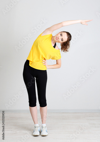 Photo: Portrait of beautiful young woman exercises Portrait of beautiful young woman exercises