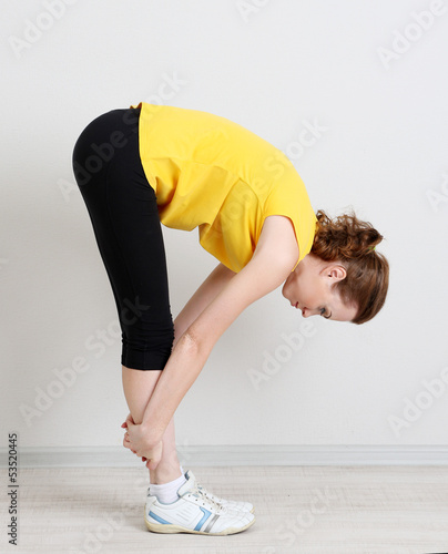 Photo: Portrait of beautiful young woman exercises Portrait of beautiful young woman exercises