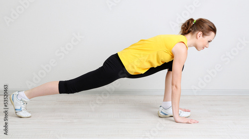 Photo: Portrait of beautiful young woman exercises Portrait of beautiful young woman exercises