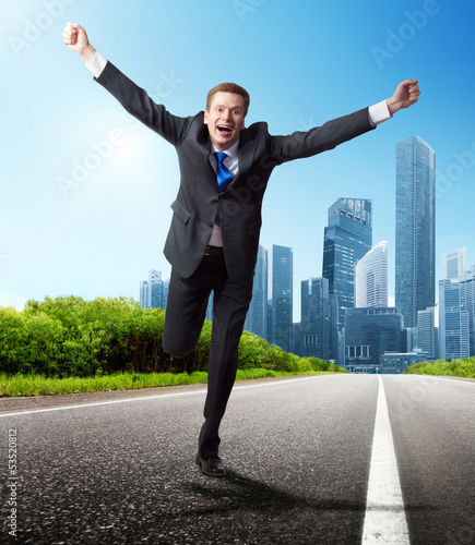 Photo: business man run on the road business man run on the road