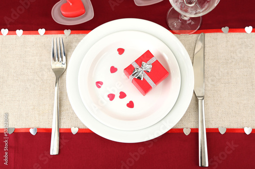 Photo: Table setting in honor of Valentine's Day close-up Table setting in honor of Valentine's Day close-up