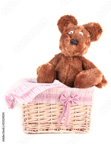 Photo: Beautiful basket with toy bear isolated on white Beautiful basket with toy bear isolated on white