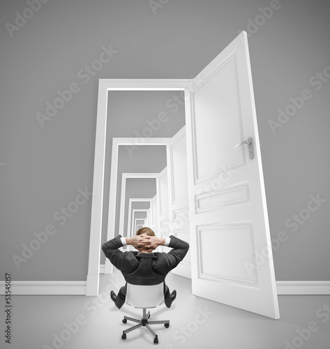 Photo: businnessman and openet doors businnessman and openet doors
