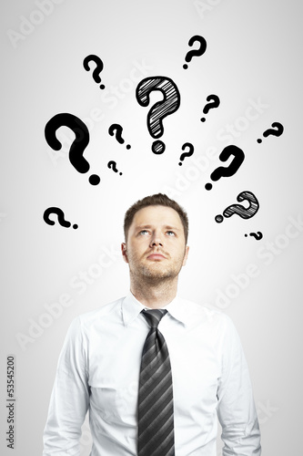 Photo: man with questions symbol man with questions symbol