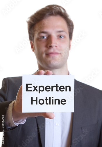 Photo: Mann im Anzug mit Karte EXPERTEN HOTLINE Mann im Anzug mit Karte EXPERTEN HOTLINE