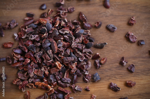 Photo: Cacao or cocoa raw beans, crushed to nibs, superfood Cacao or cocoa raw beans, crushed to nibs, superfood